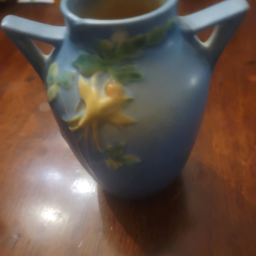 Artistic Blue Vase with Yellow Floral Accent